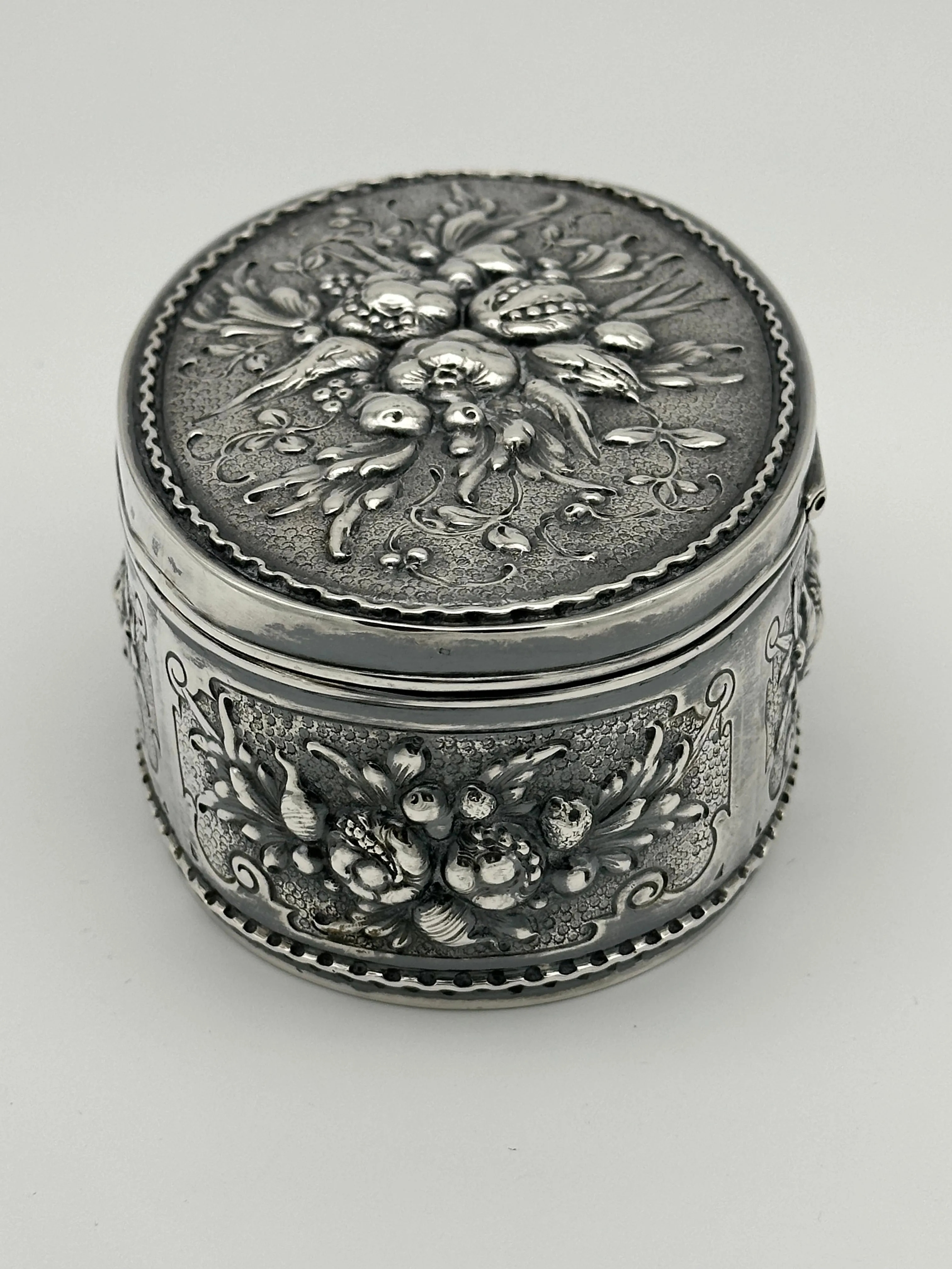 German 800 Silver Repousse Box. Fruits and Leaves. Circa 1890. 5 1/4" x 3 1/2"