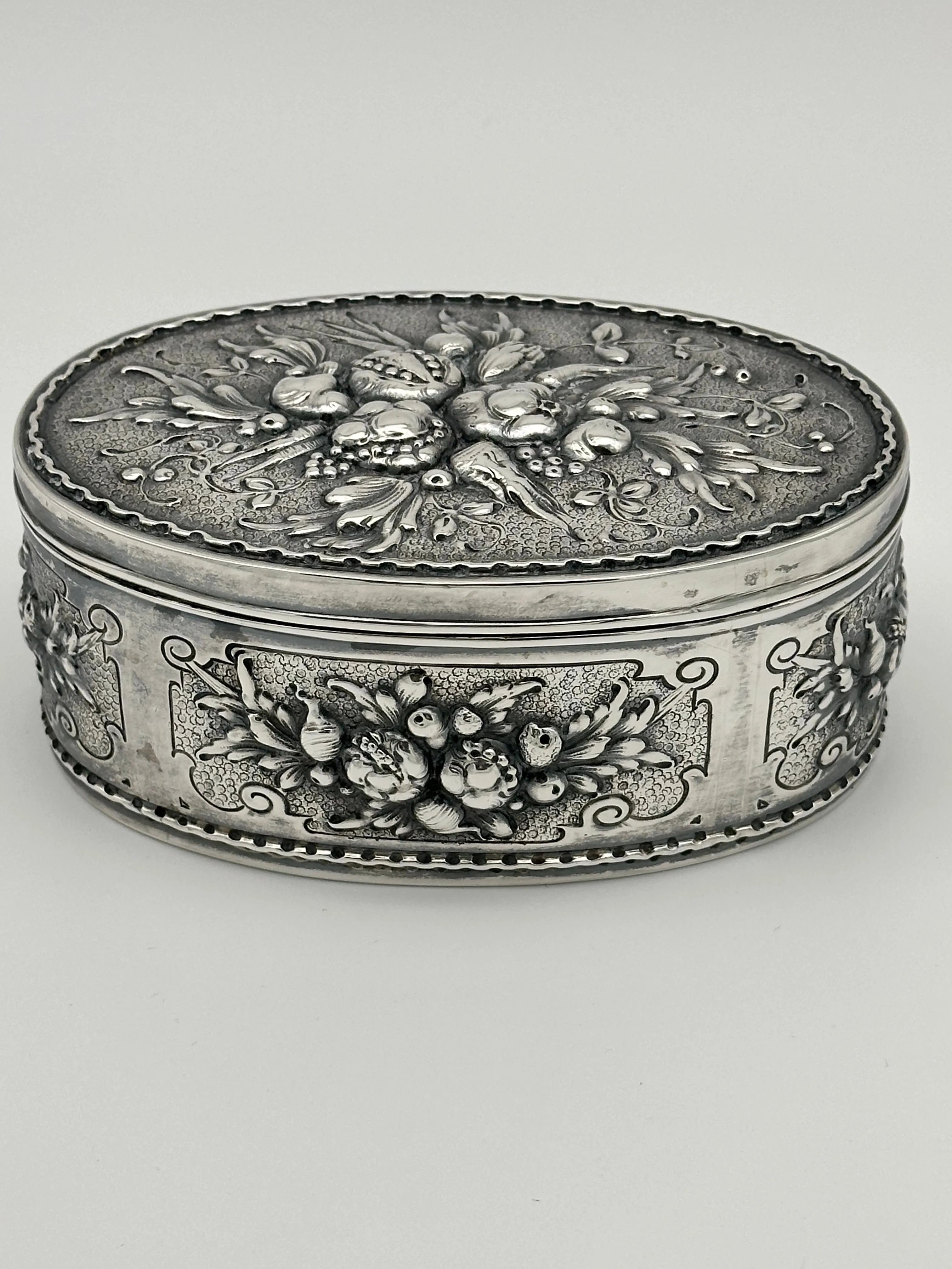 German 800 Silver Repousse Box. Fruits and Leaves. Circa 1890. 5 1/4" x 3 1/2"