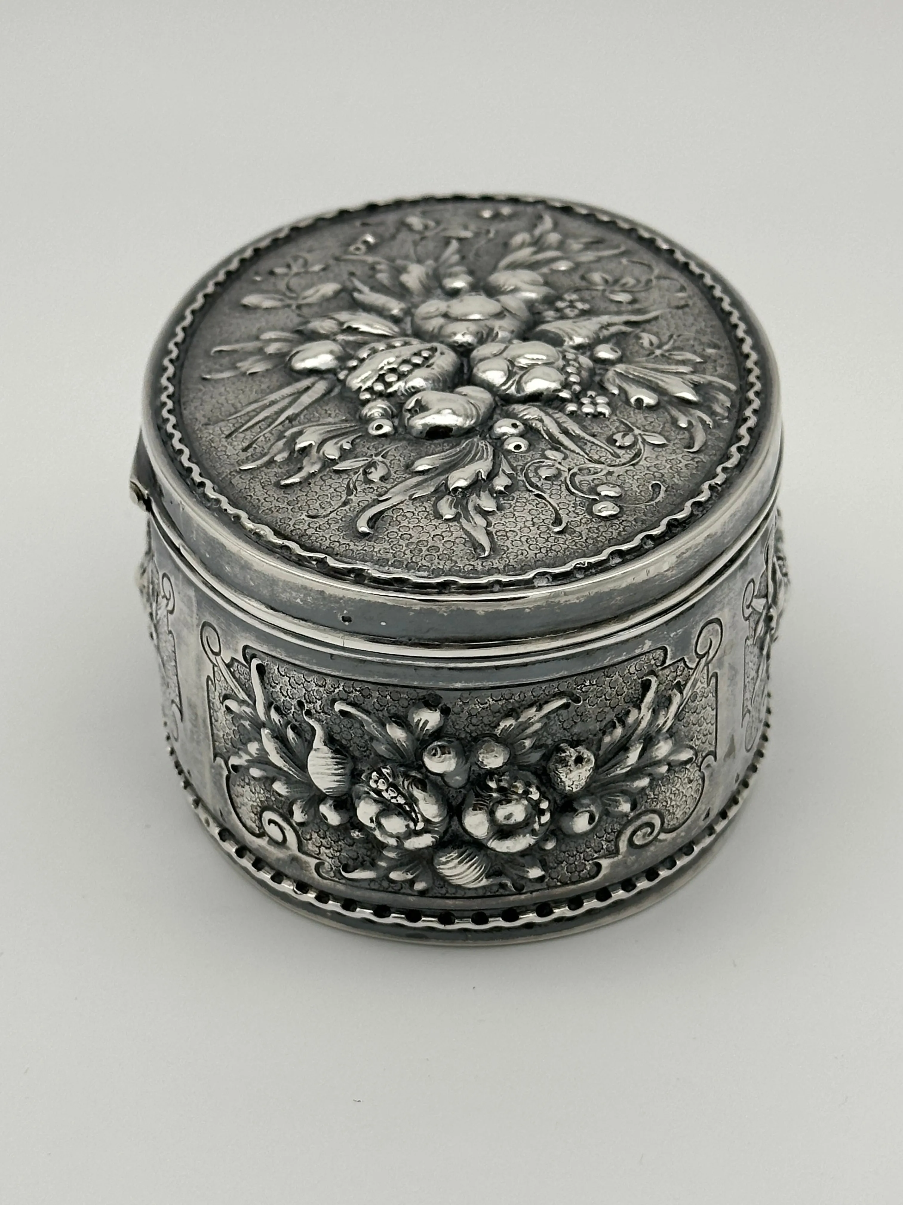 German 800 Silver Repousse Box. Fruits and Leaves. Circa 1890. 5 1/4" x 3 1/2"