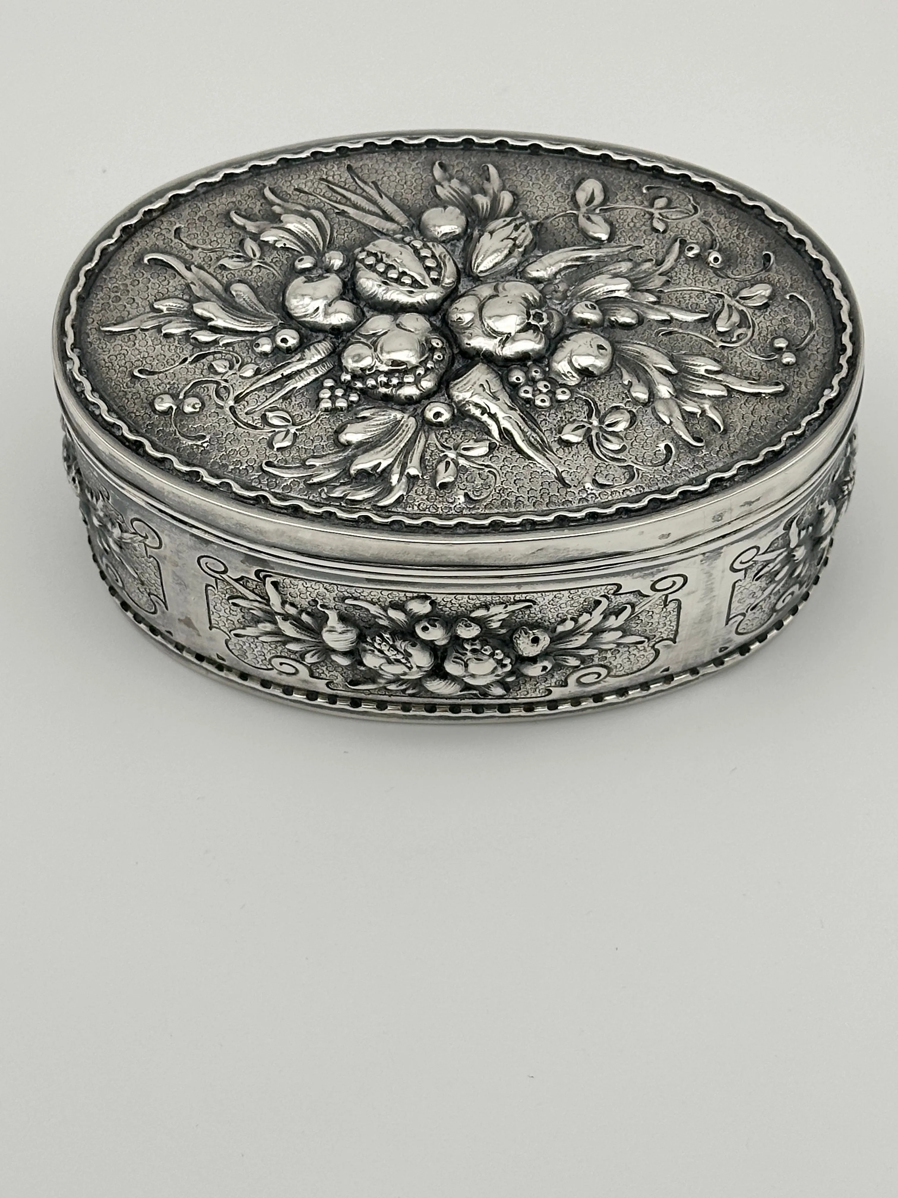 German 800 Silver Repousse Box. Fruits and Leaves. Circa 1890. 5 1/4" x 3 1/2"